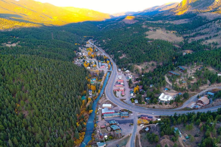 Aerial view of Bailey, Colorado, in a forested mountain valley