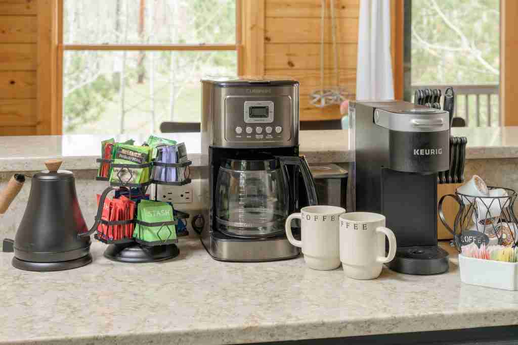 Coffee station with a drip coffee maker, Keurig, kettle, and mugs