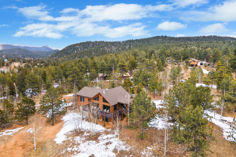 Aerial view of Rosalie Ridge Cabin in the pines near Deer Creek Valley Ranch