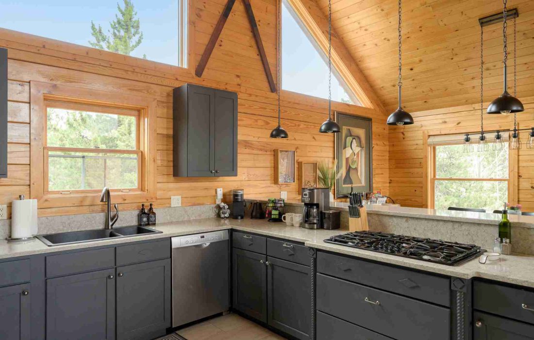 Kitchen counters with a gas range and pendant lights