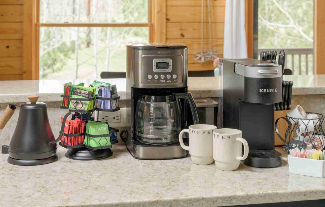 Coffee station with a drip coffee maker, Keurig, kettle, and mugs